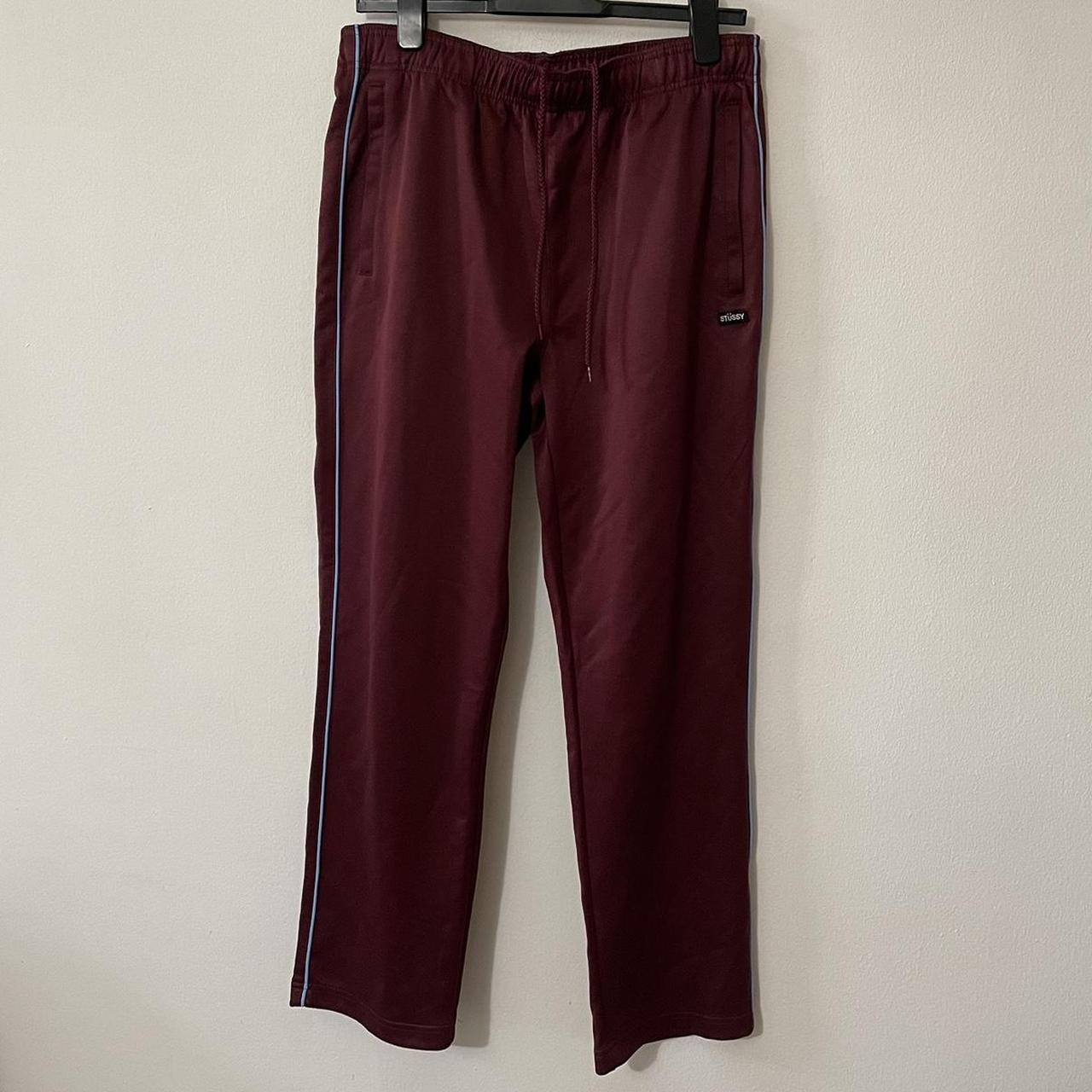 Stussy wine color track pants. Blue piping detail. | Depop
