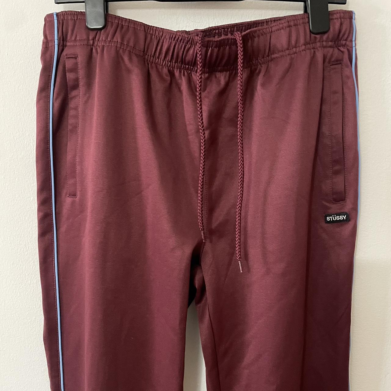 Stussy wine color track pants. Blue piping detail. | Depop