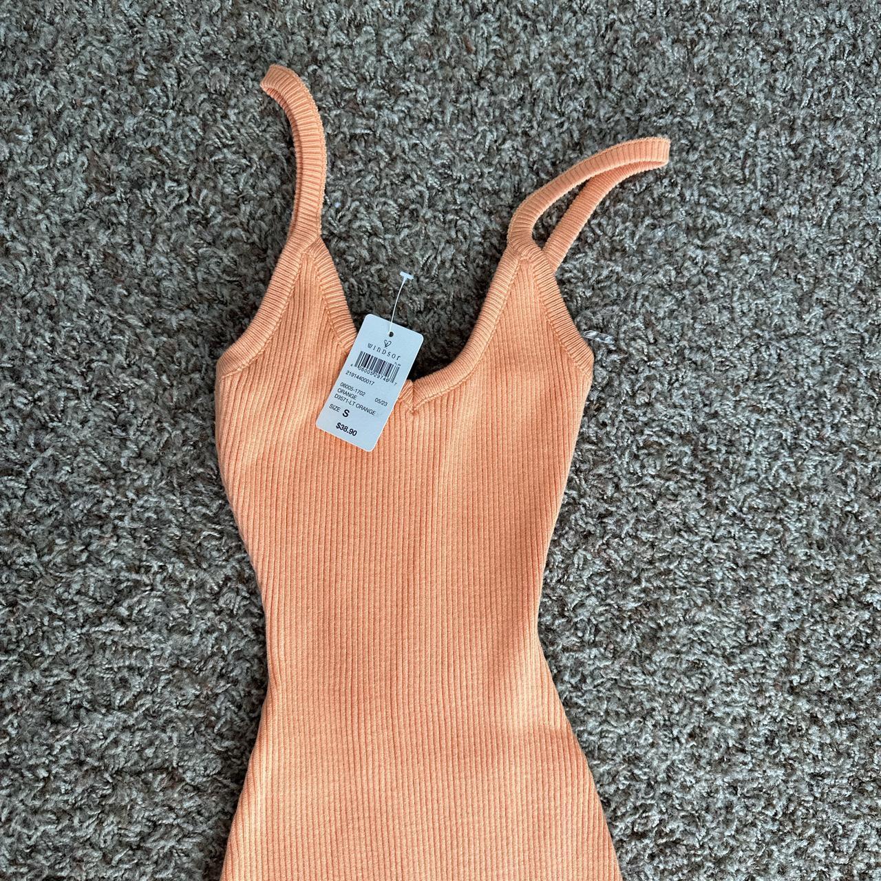 Never worn orange ribbed dress with slit from Windsor Depop