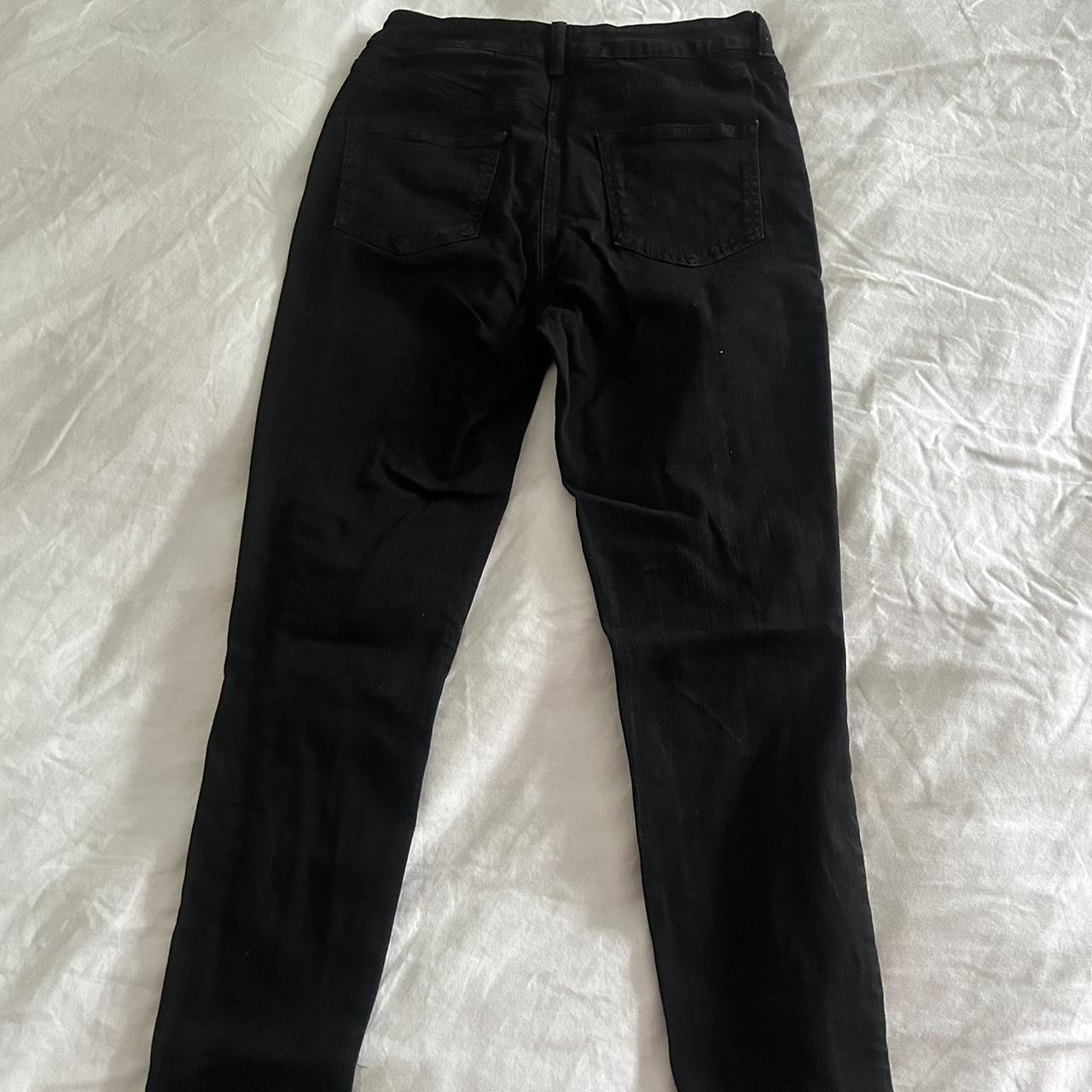 Jet black mid rise denim jeans with knee rips Skinny... - Depop