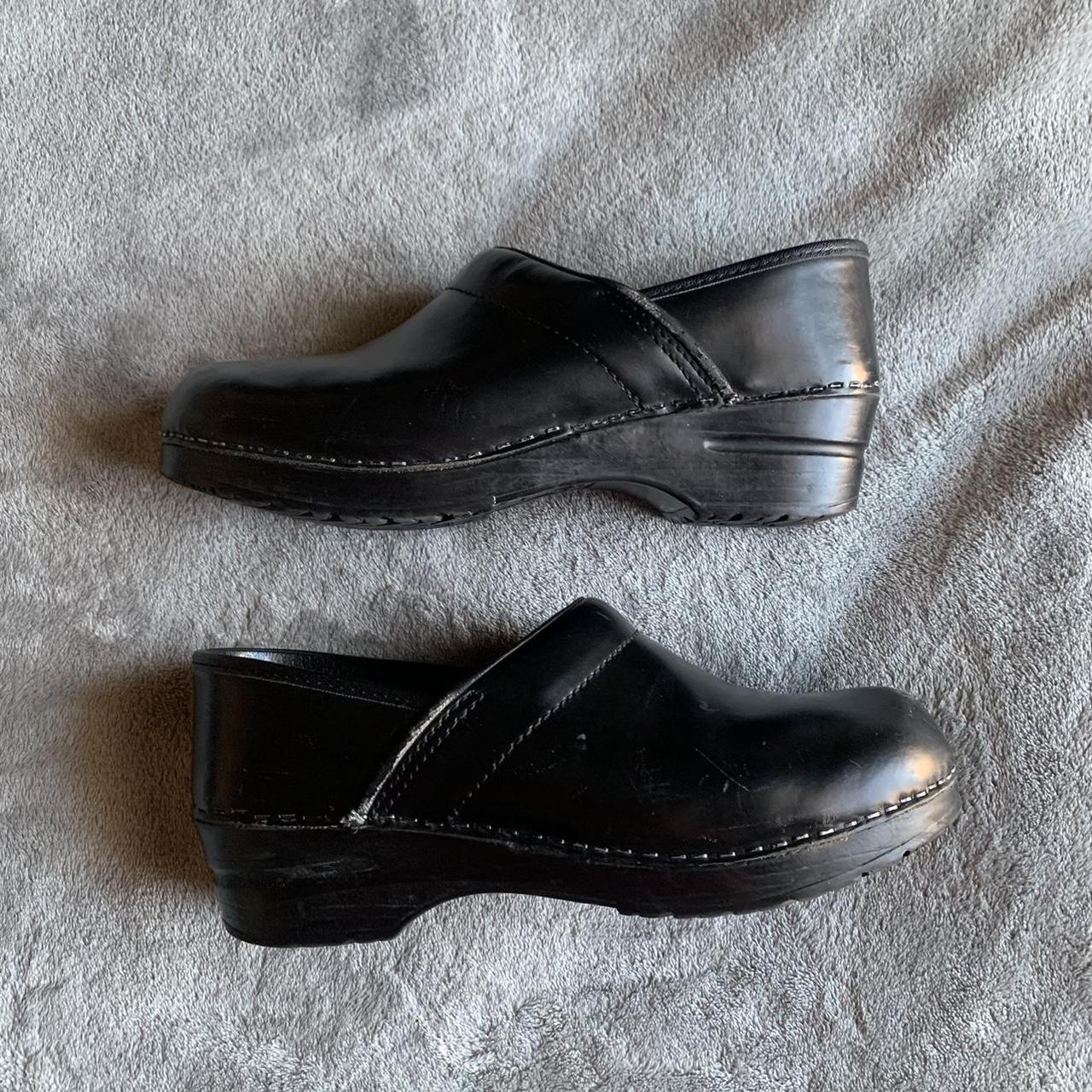 Dansko Women's Black Clogs | Depop