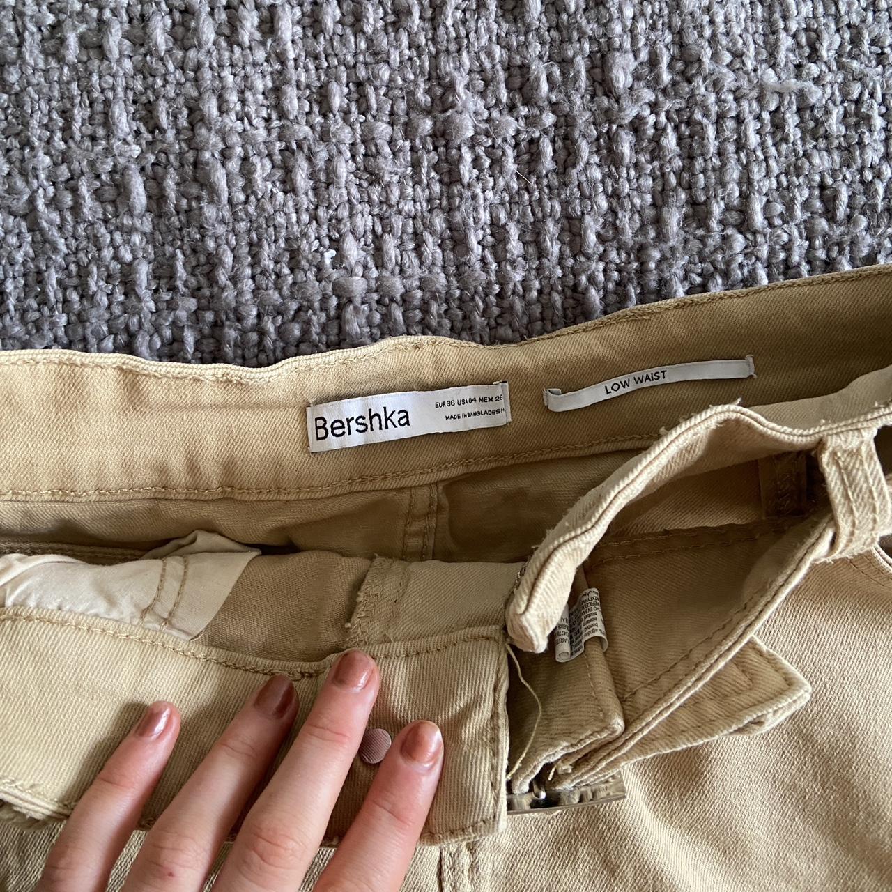 Beige Bershka low waisted mini skirt with... - Depop