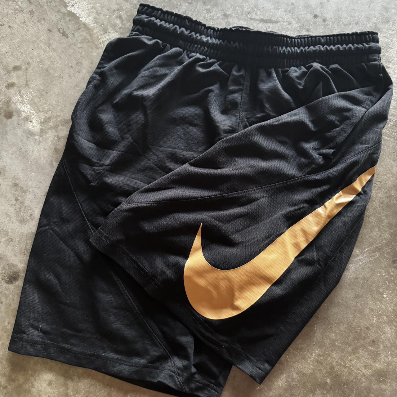nike gold and black shorts