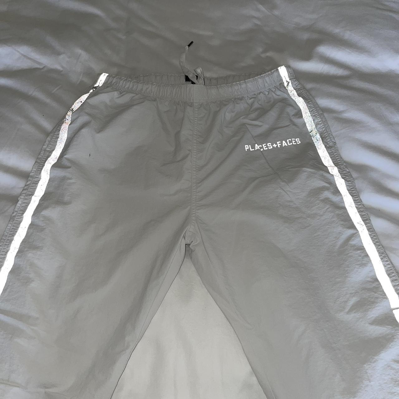 White reflective places + faces tracksuit bottoms.... Depop