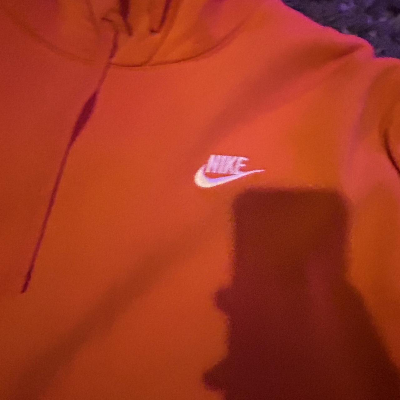 white nike hoodie with orange logo