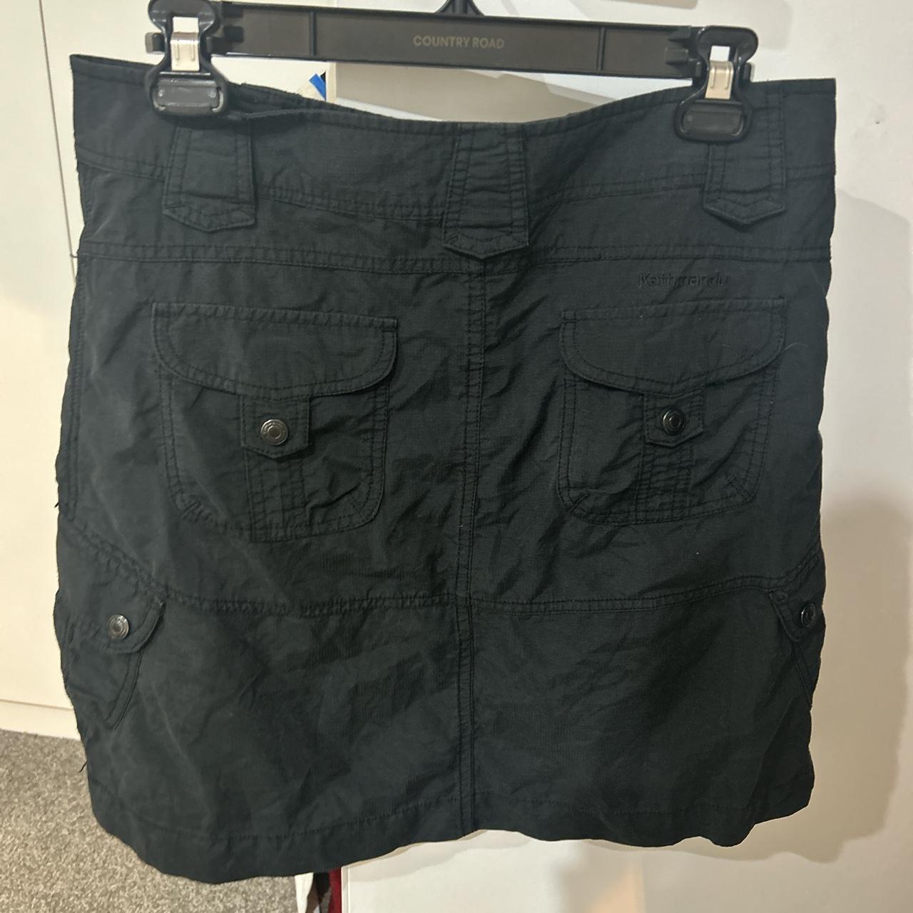 Kathmandu women’s black cargo skirt never worn, in... Depop