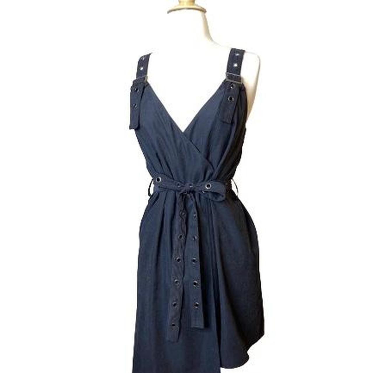 This utility dress showcases a modern twist with its... - Depop