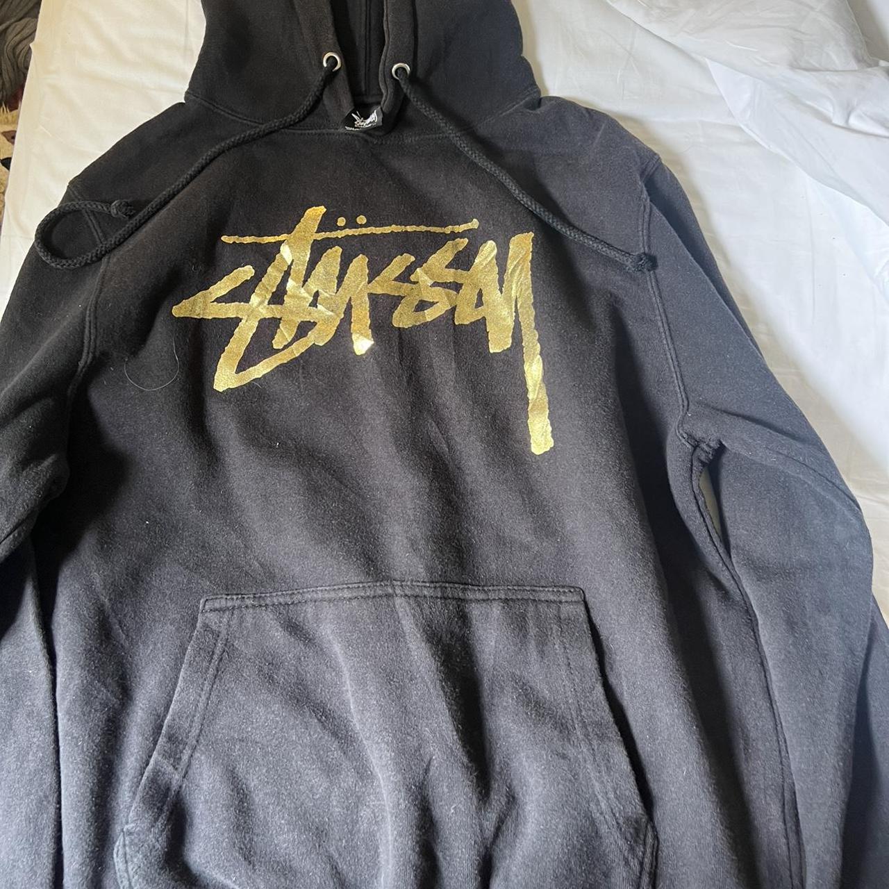 Black Stussy hoodie with gold metallic logo - Depop