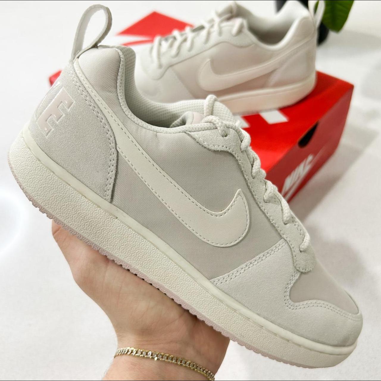 cream and black nike