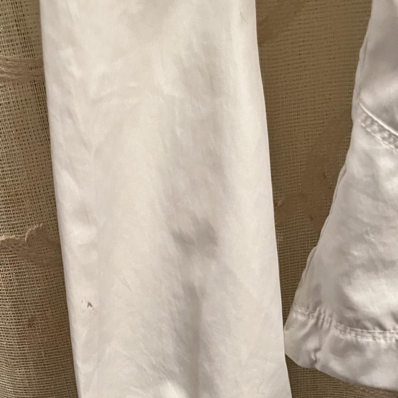 Woman’s Nike jacket tiny spot on sleeve shown in... - Depop