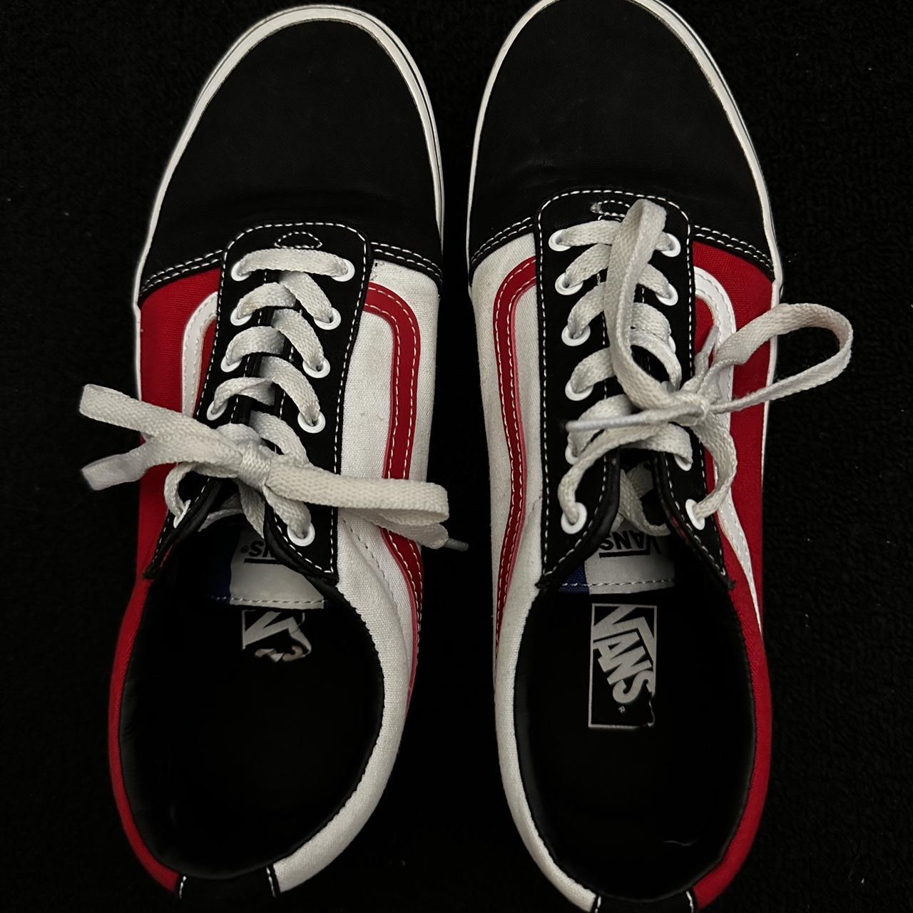 Black and white 2025 vans with red laces