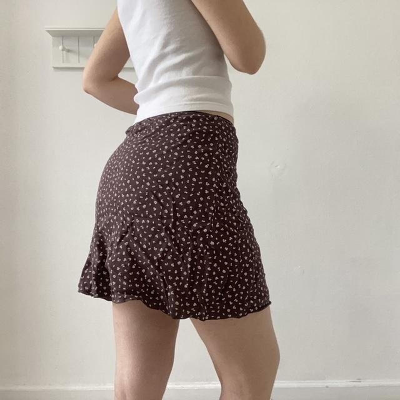 The beautiful brown floral mini skirt with an...