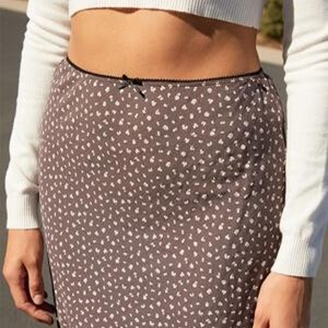 The beautiful brown floral mini skirt with an...