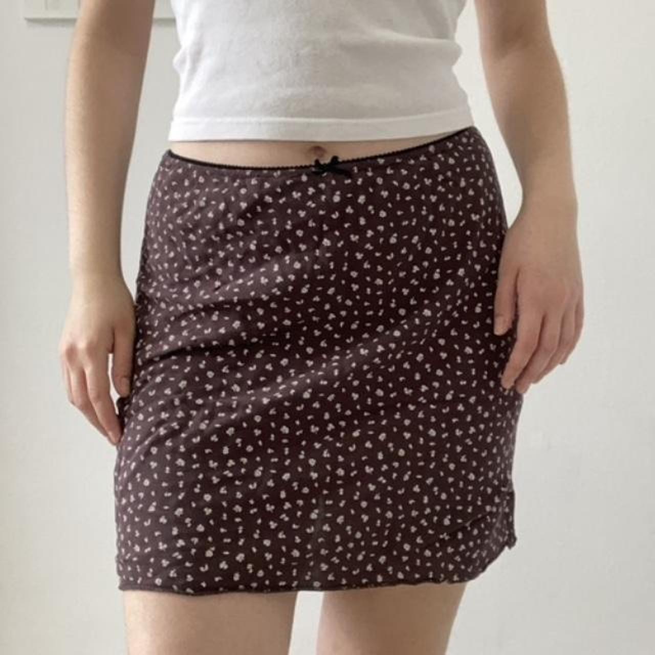 The beautiful brown floral mini skirt with an...
