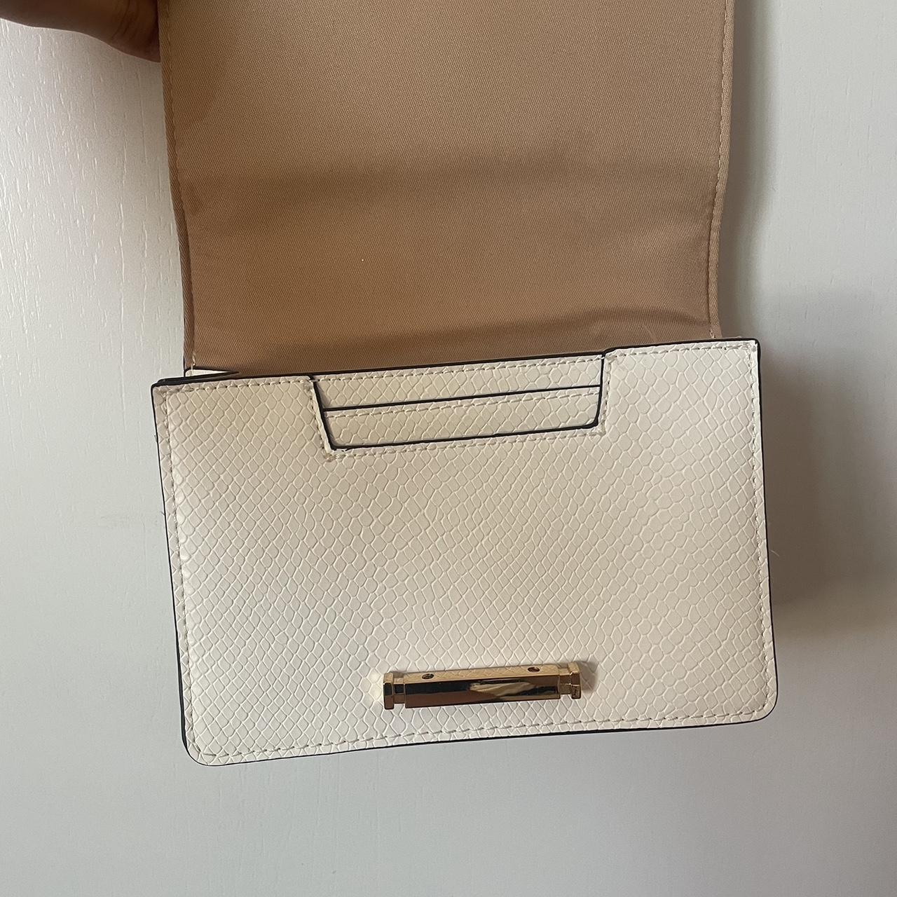 White butterfly cross body purse from aldo I used it... Depop