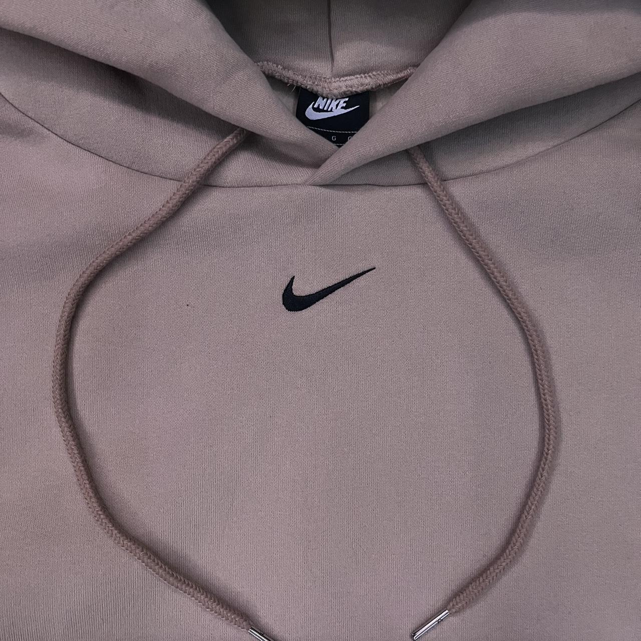 tan nike hoodie with black swoosh