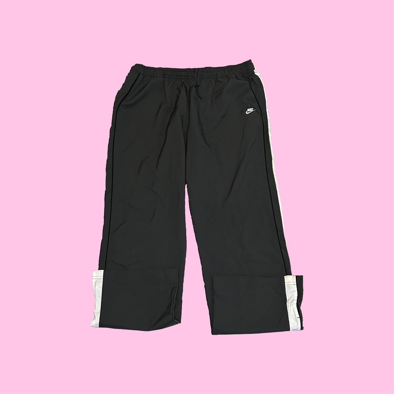 Y2k Nike track pants with side stripes model off - Depop