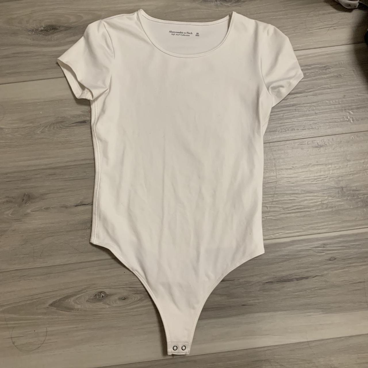 Abercrombie and fitch white bodysuit from the Soft... Depop