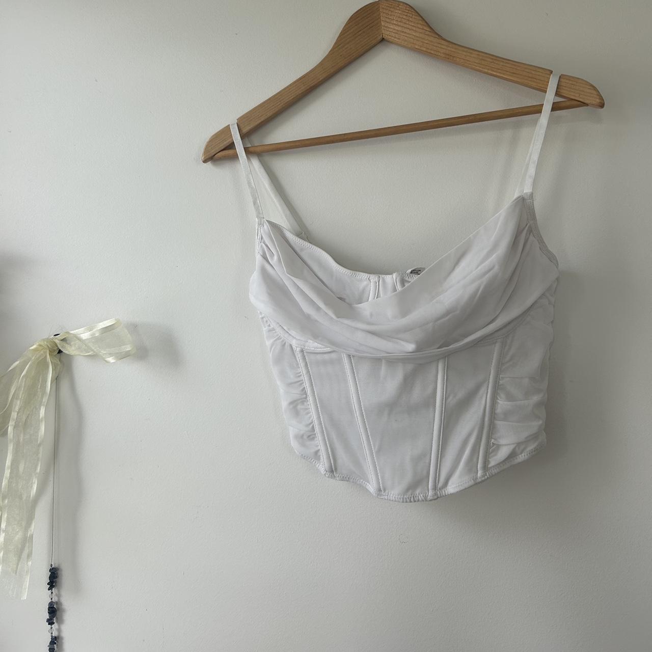 boned white corset top • wire boning down the... - Depop