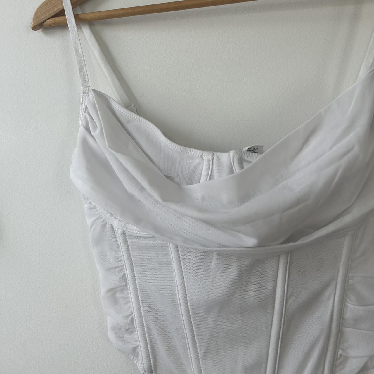 boned white corset top • wire boning down the... - Depop