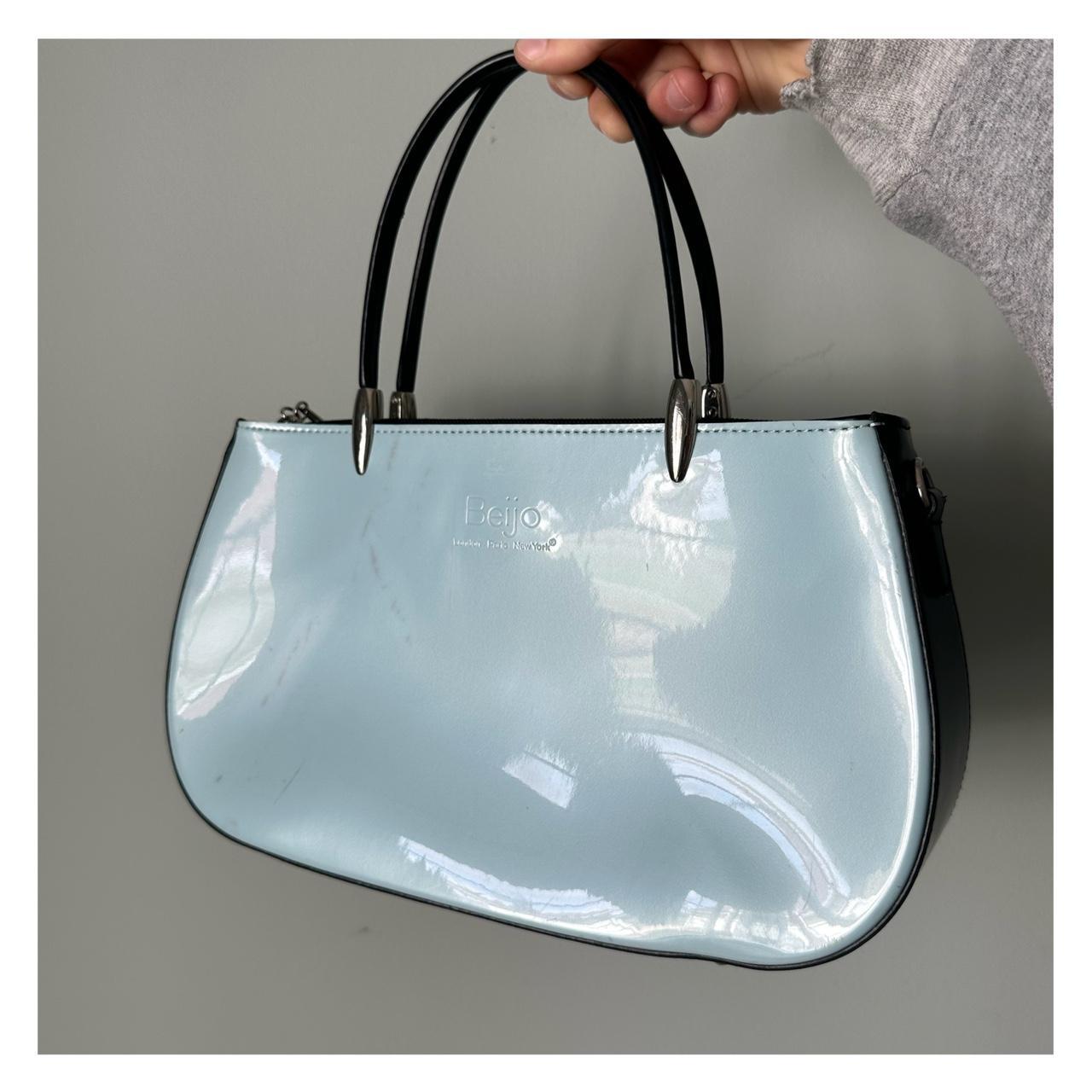 Magic eraser on online leather purse