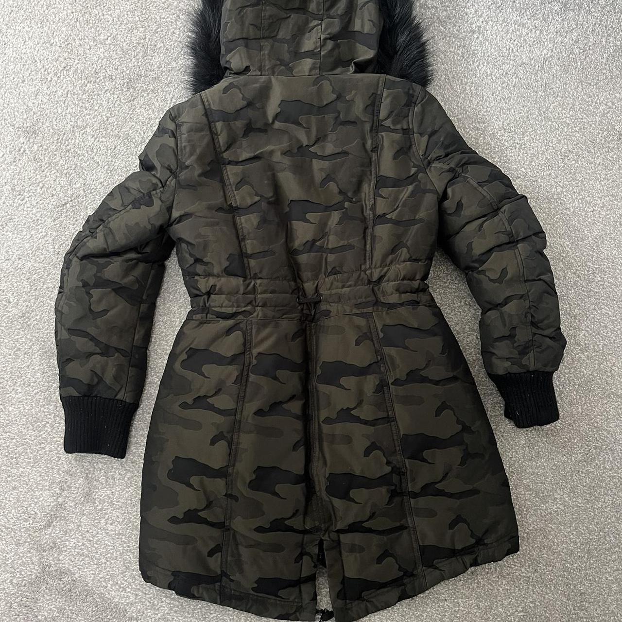 Camouflage print DKNY coat. Fleece lined hood with