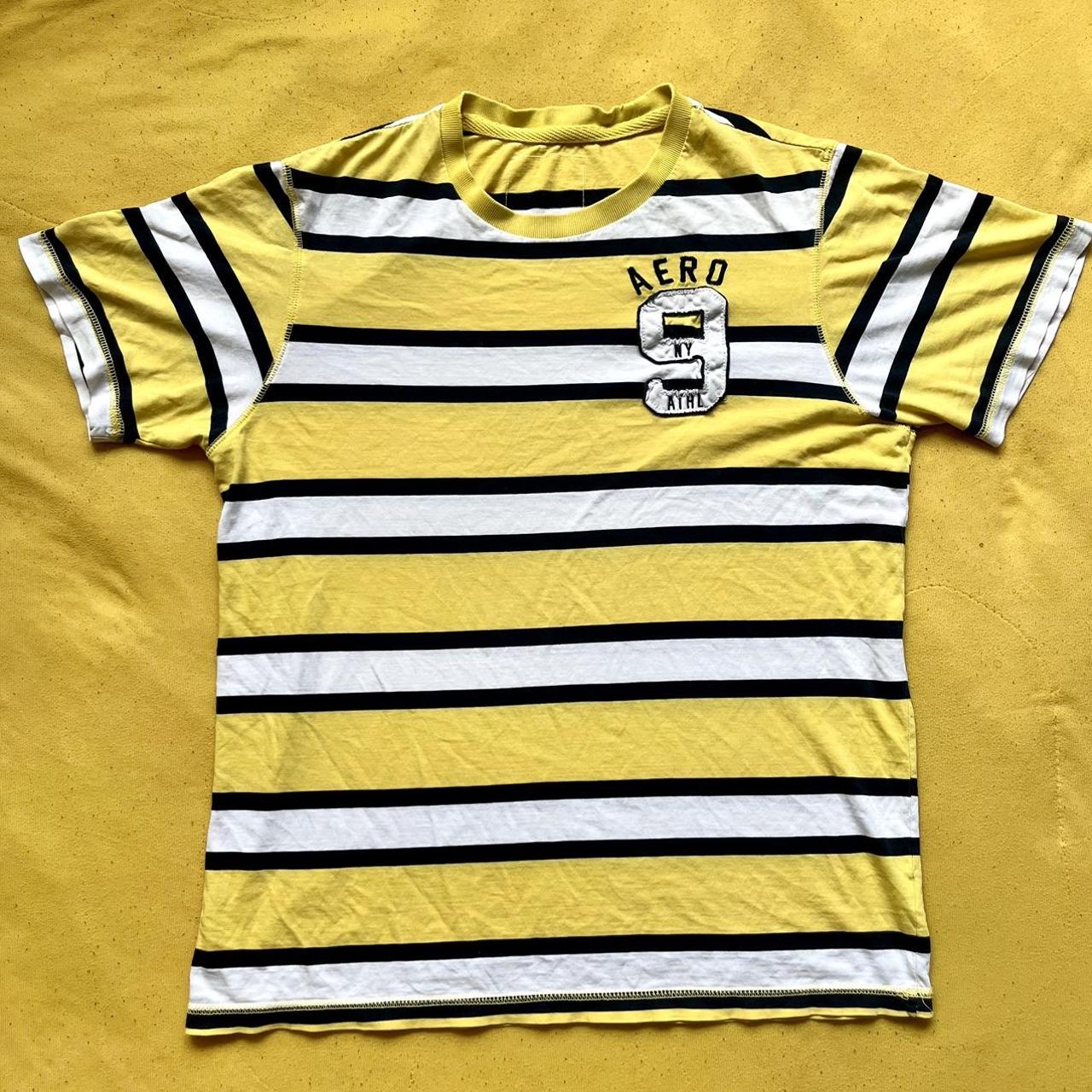 Yellow tee with black and white stripes. A little... - Depop