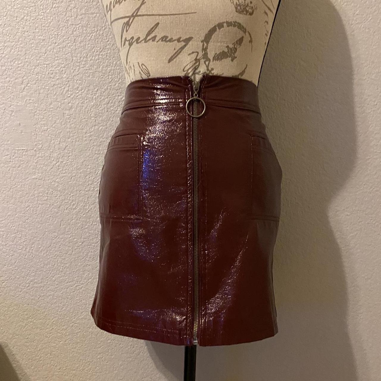 Burgundy vinyl skirt with zipper closure and front. Depop