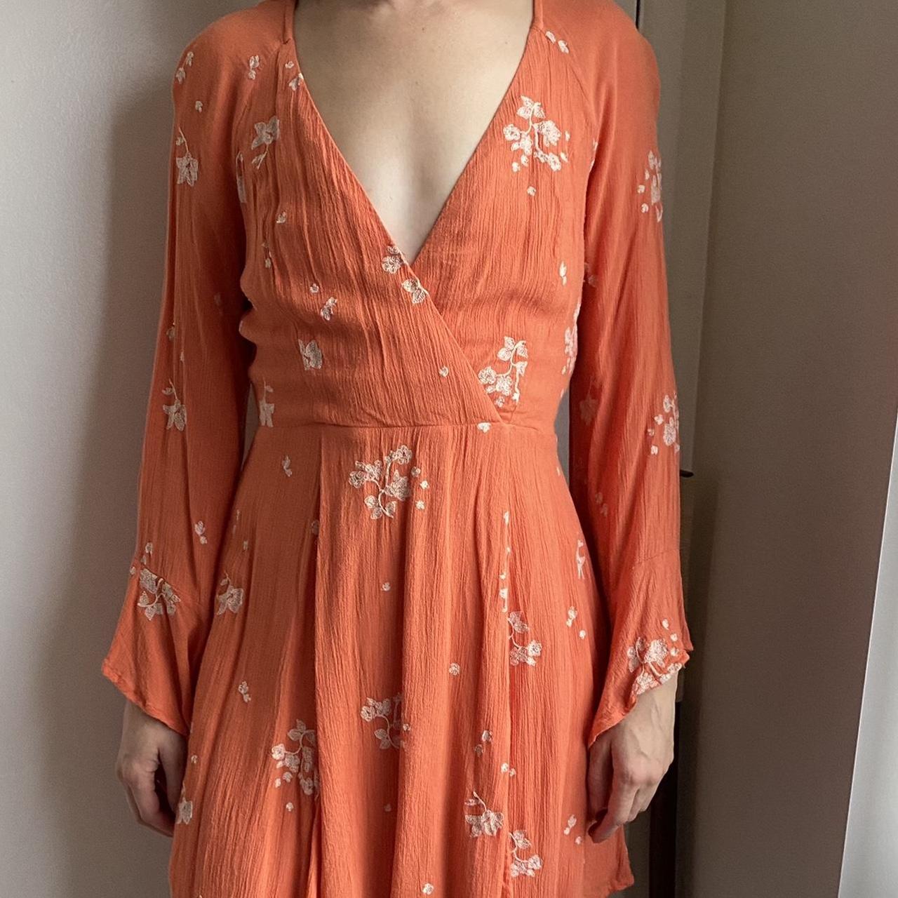 Orange dress with white flower embroidery detailing... Depop