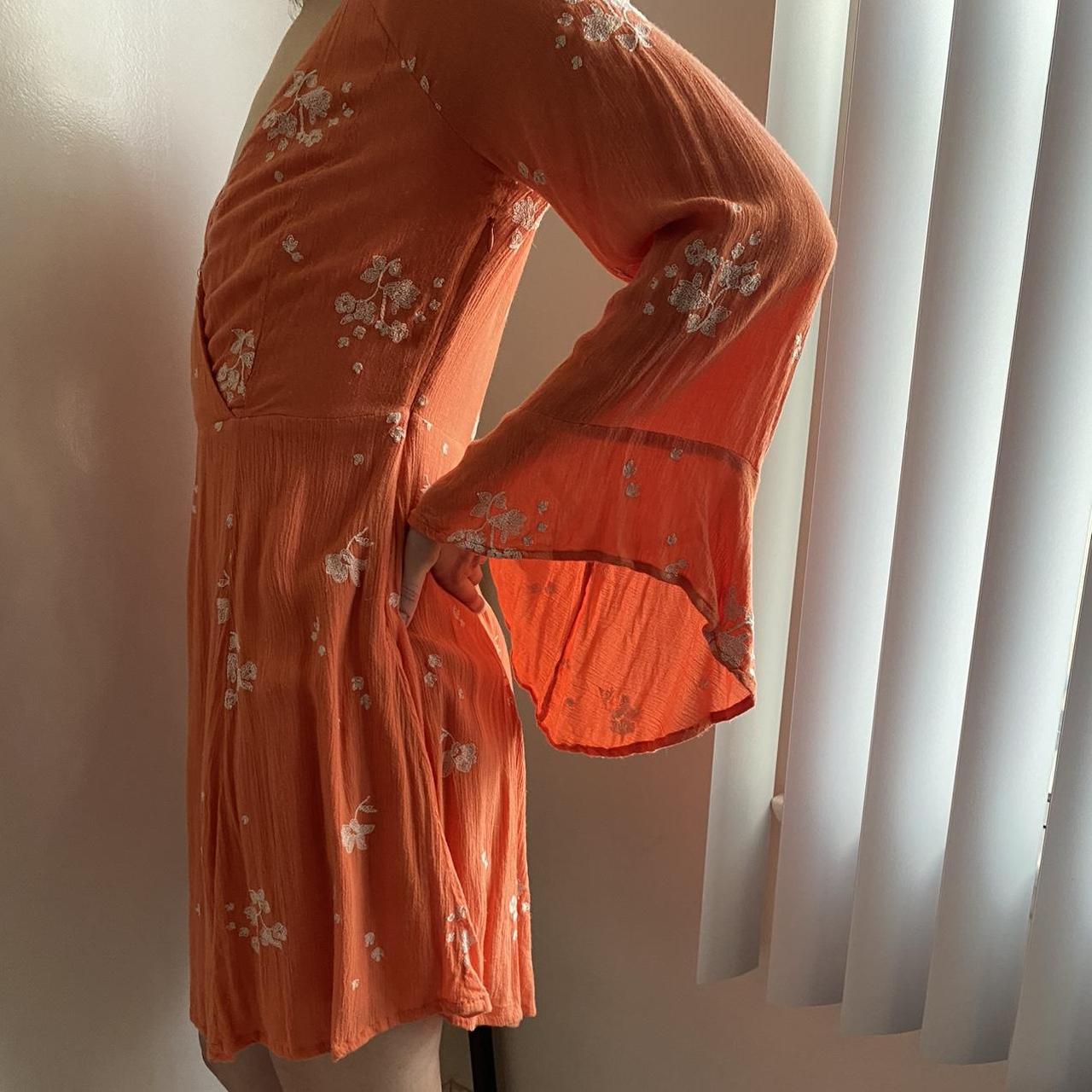 Orange dress with white flower embroidery detailing... Depop