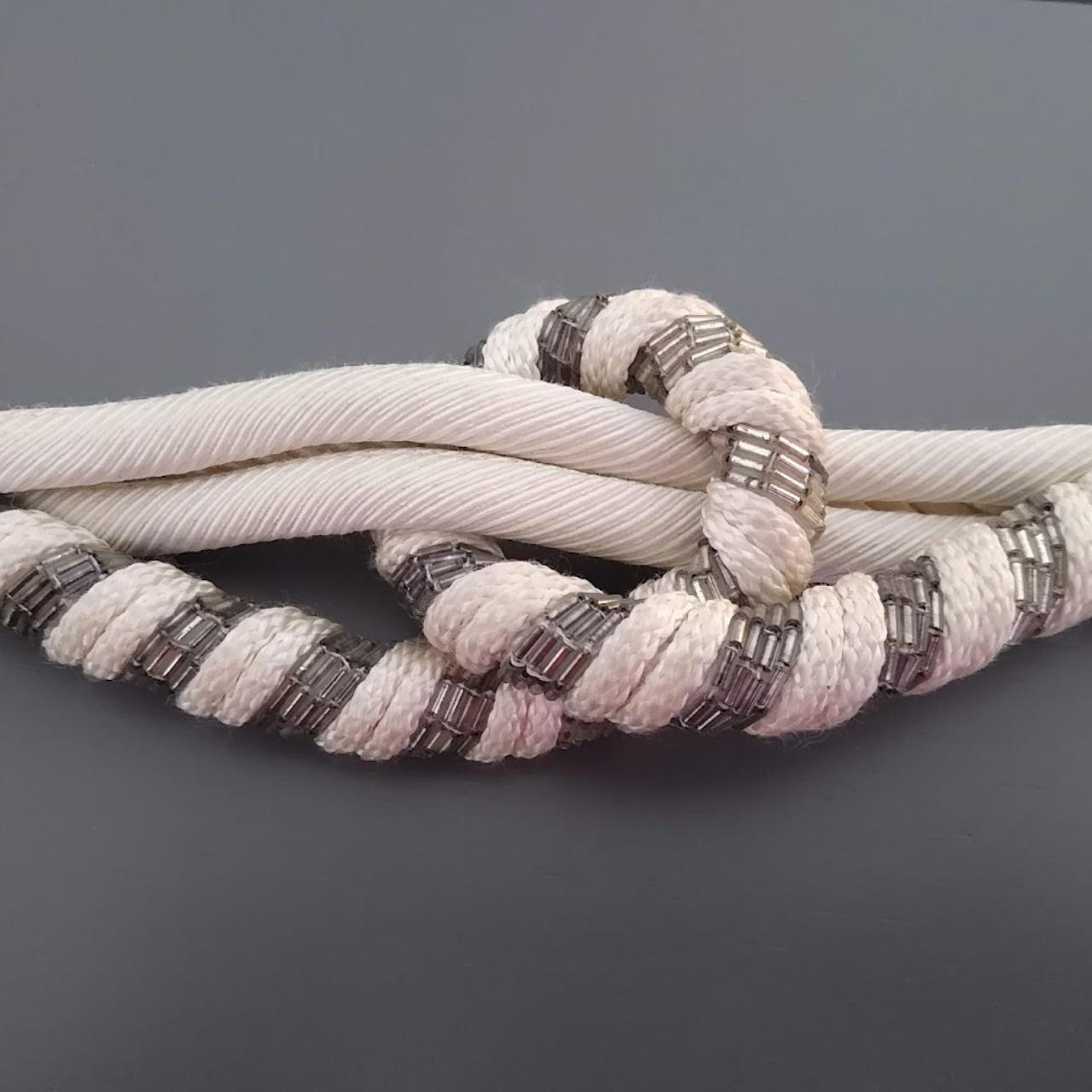 Vintage Leather Shop 1980's White and Silver Knotted... Depop