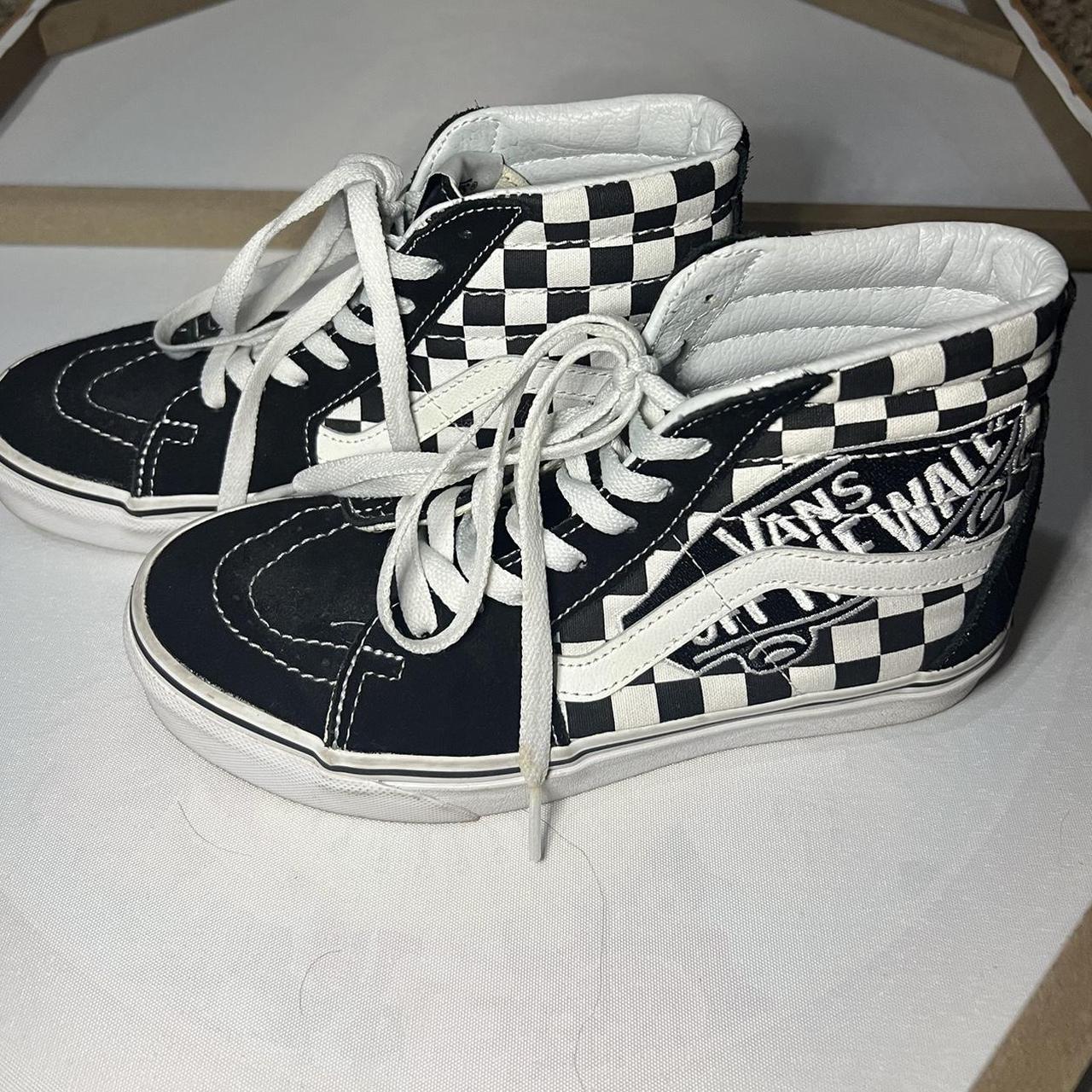 Vans black and on sale white checkered high tops