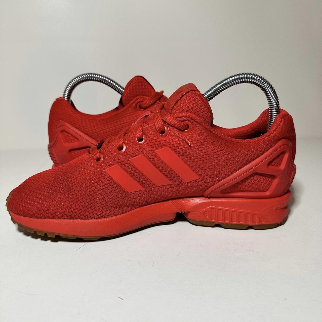 All red adidas top zx flux