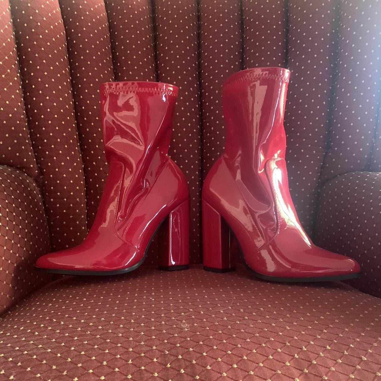 Red shiny boots looks like latex goes a little past