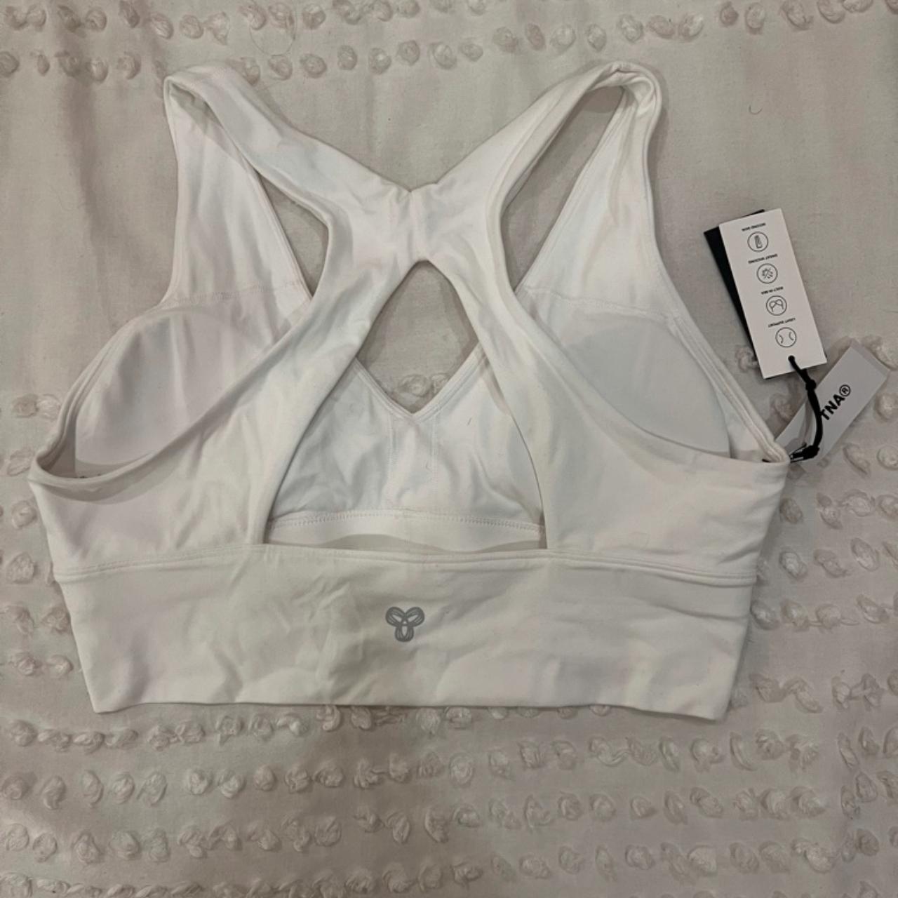 TnaBUTTER Volley sports bra core collection white - Depop