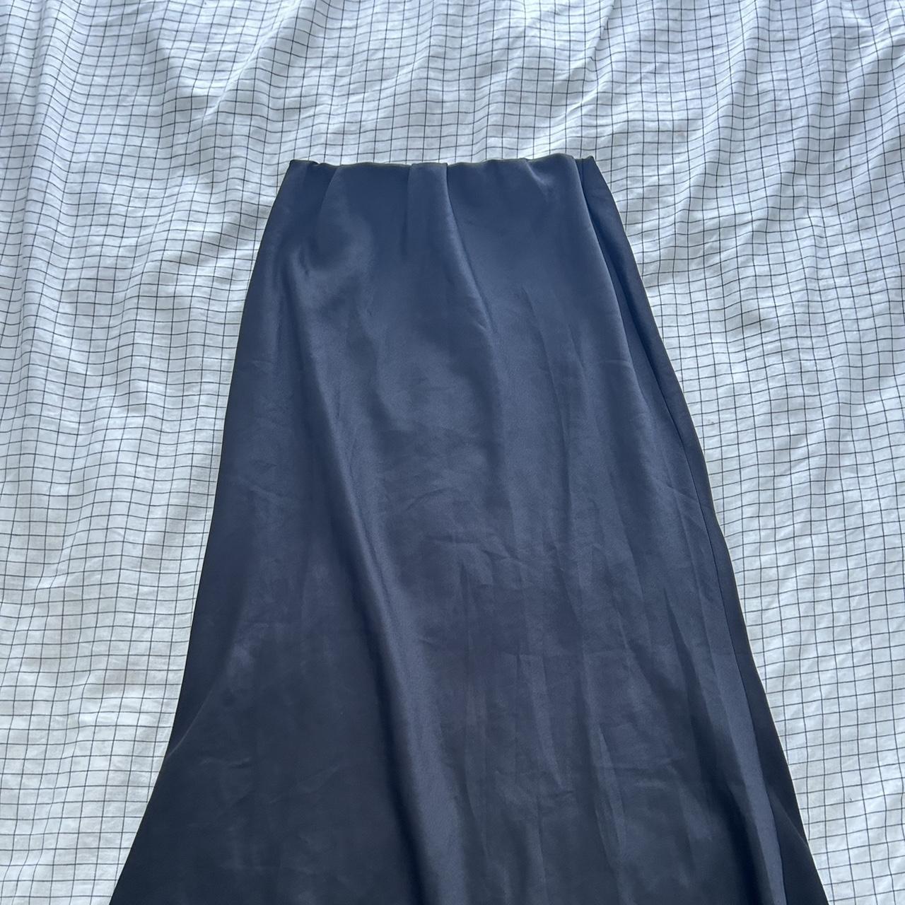 Black silky maxi skirt. Reaches down to my ankles... - Depop