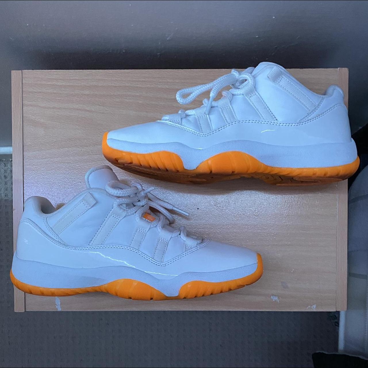 orange and white citrus jordans