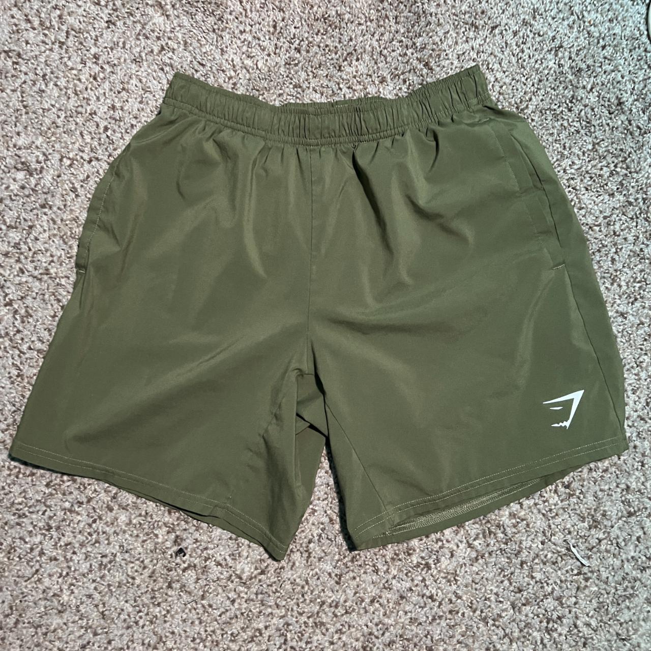 gymshark shorts in green size small 7 inch... Depop