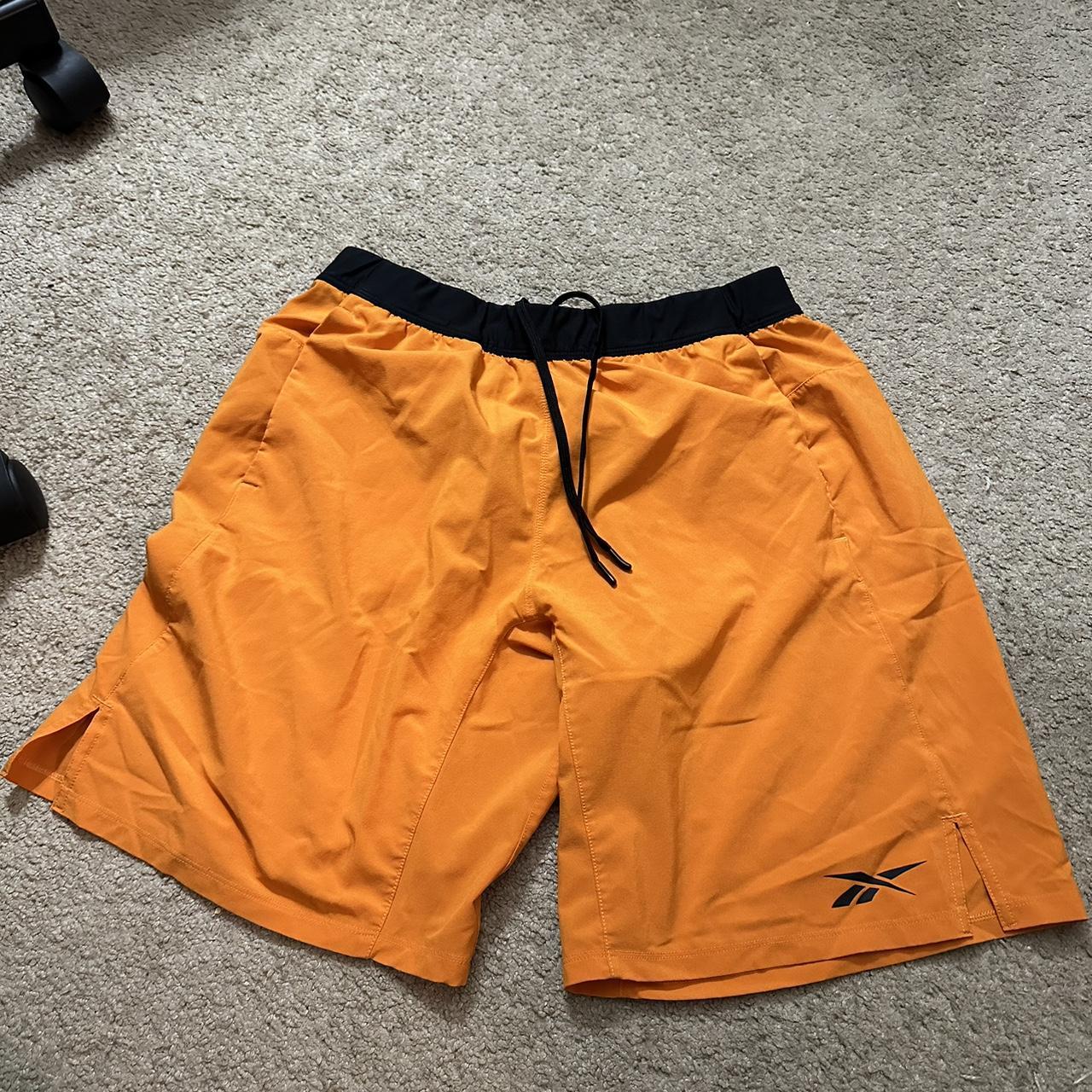 orange Rebook running shorts Depop