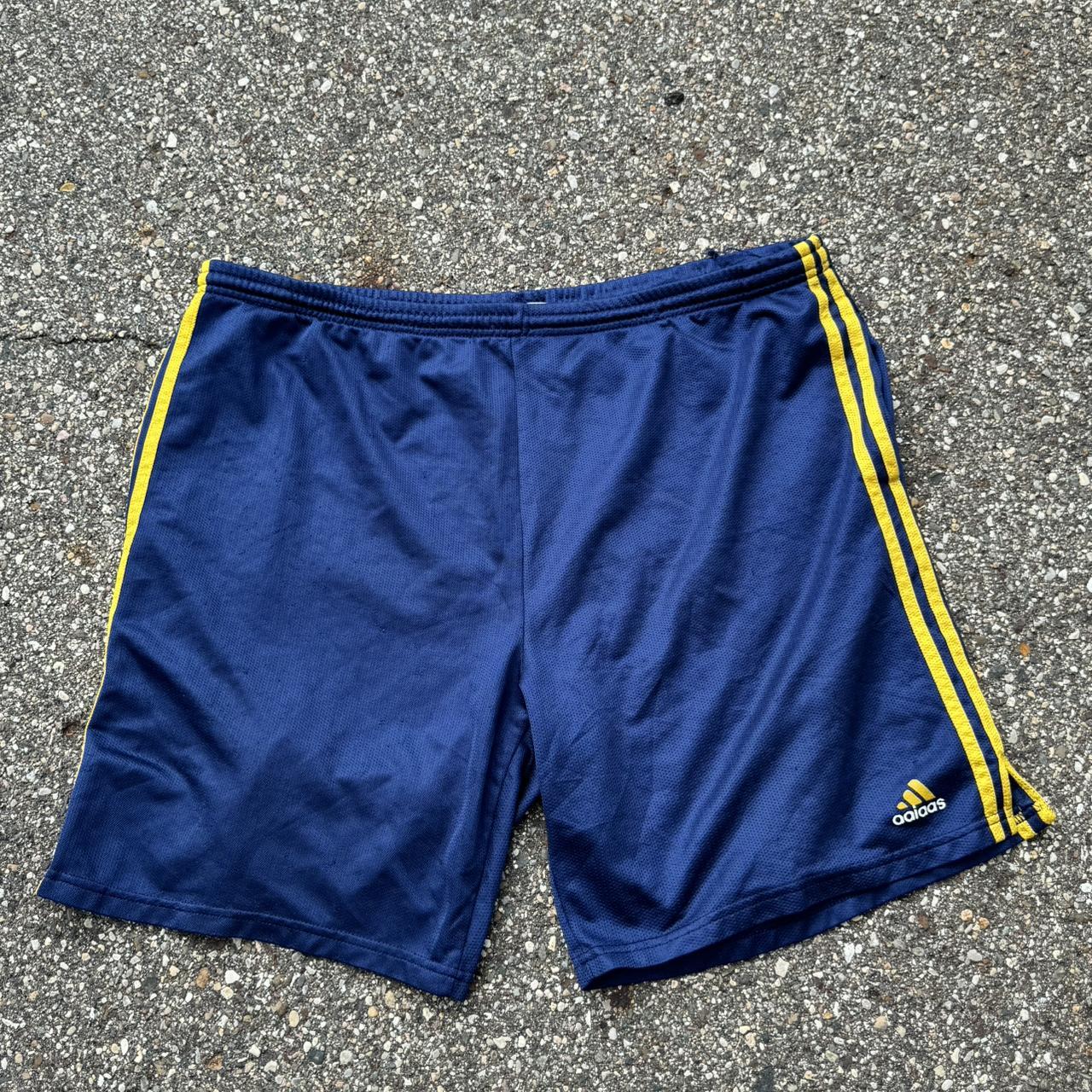 Vintage blue and yellow Adidas shorts. Small rip on