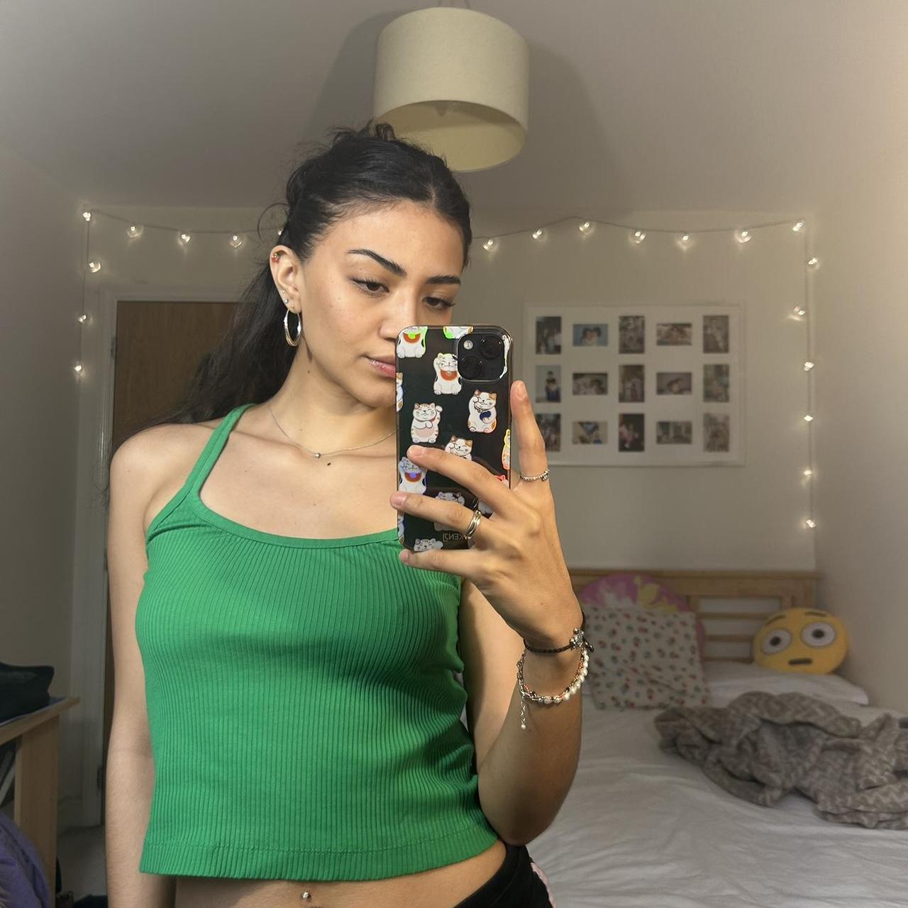 Green cropped vest from zara. Size small so fits 810. Depop