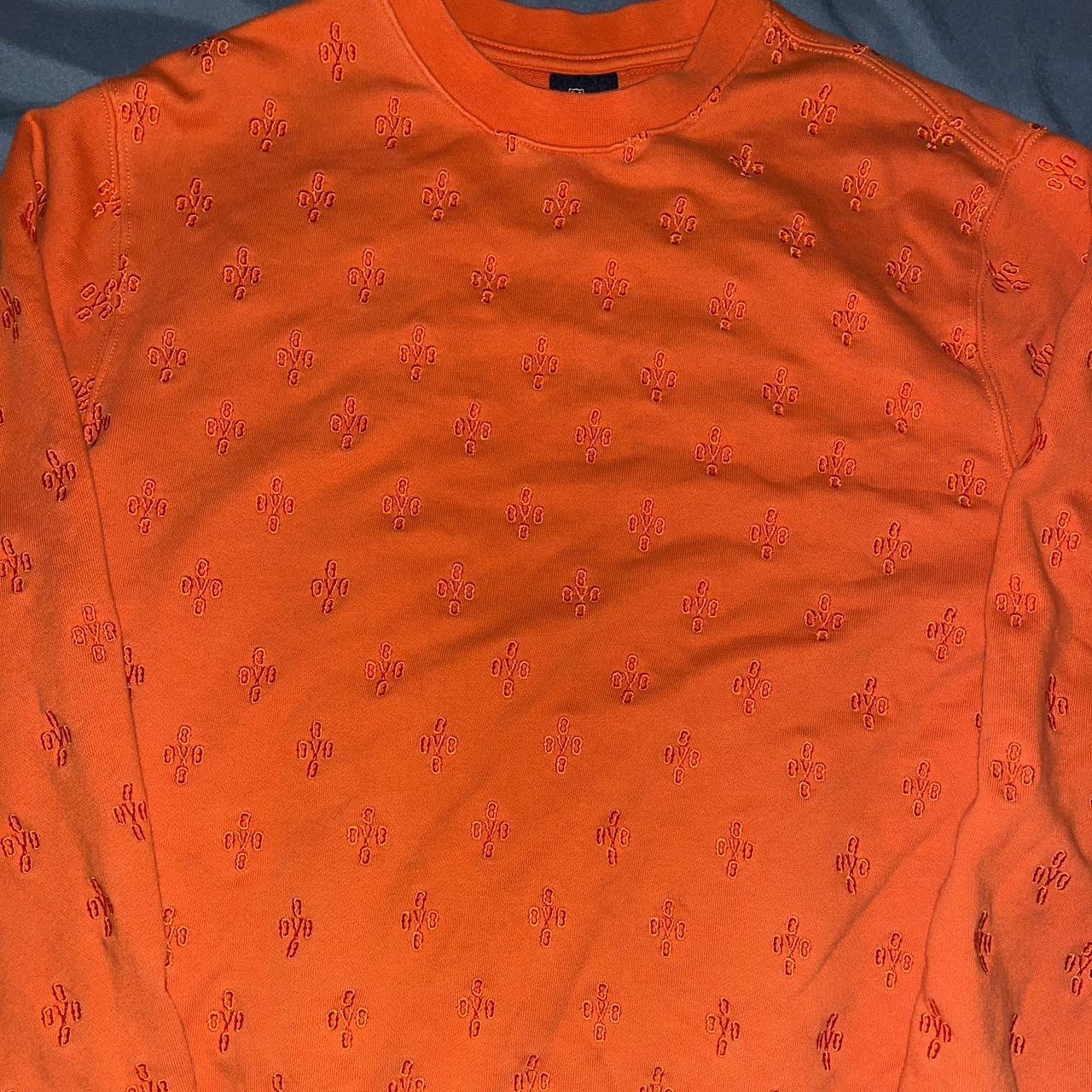 orange monogram sweater
