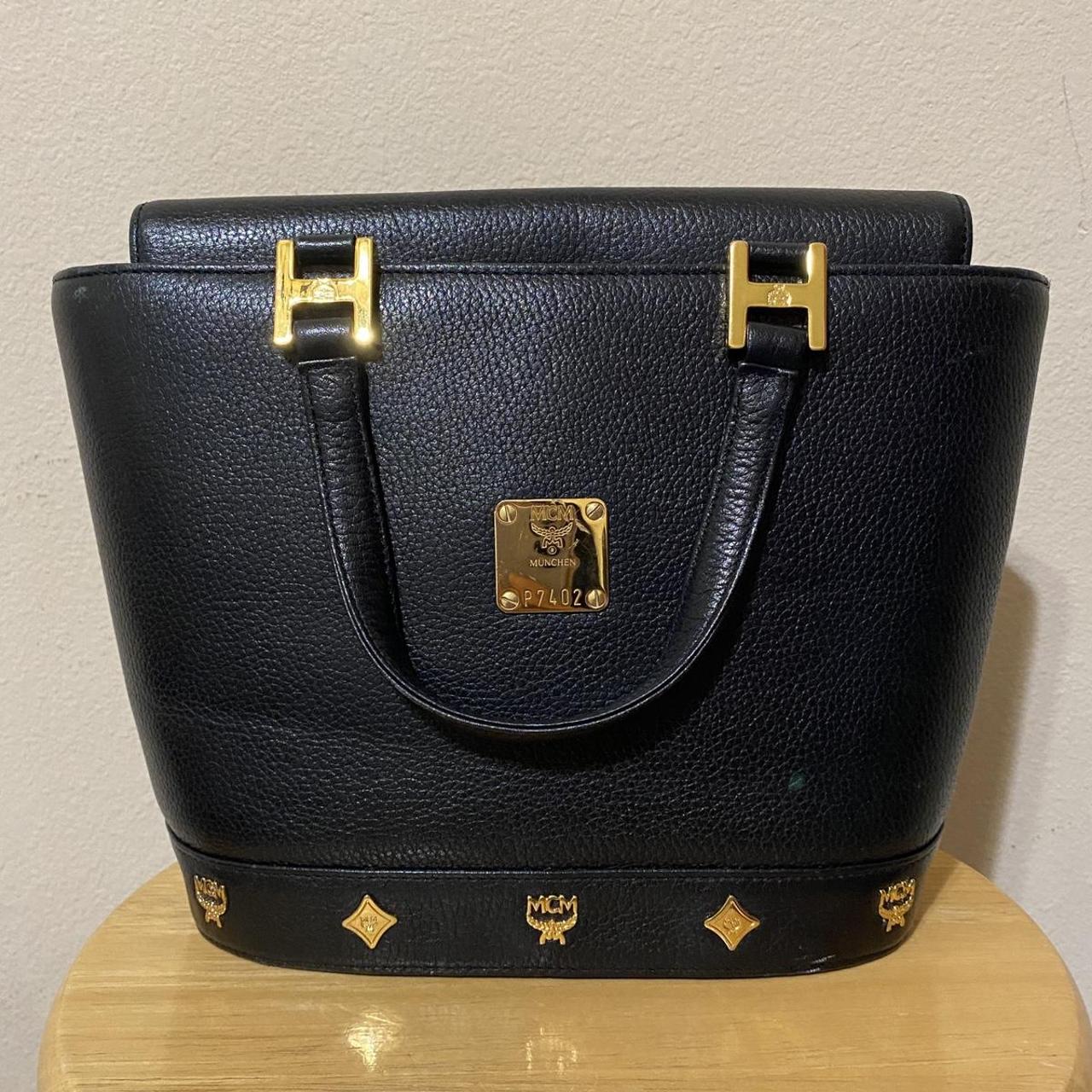 Black and gold online mcm bag