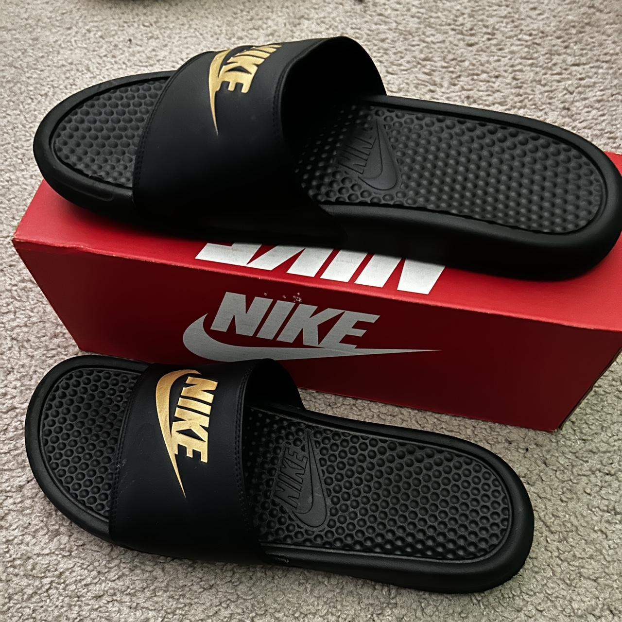 nike black and gold sliders