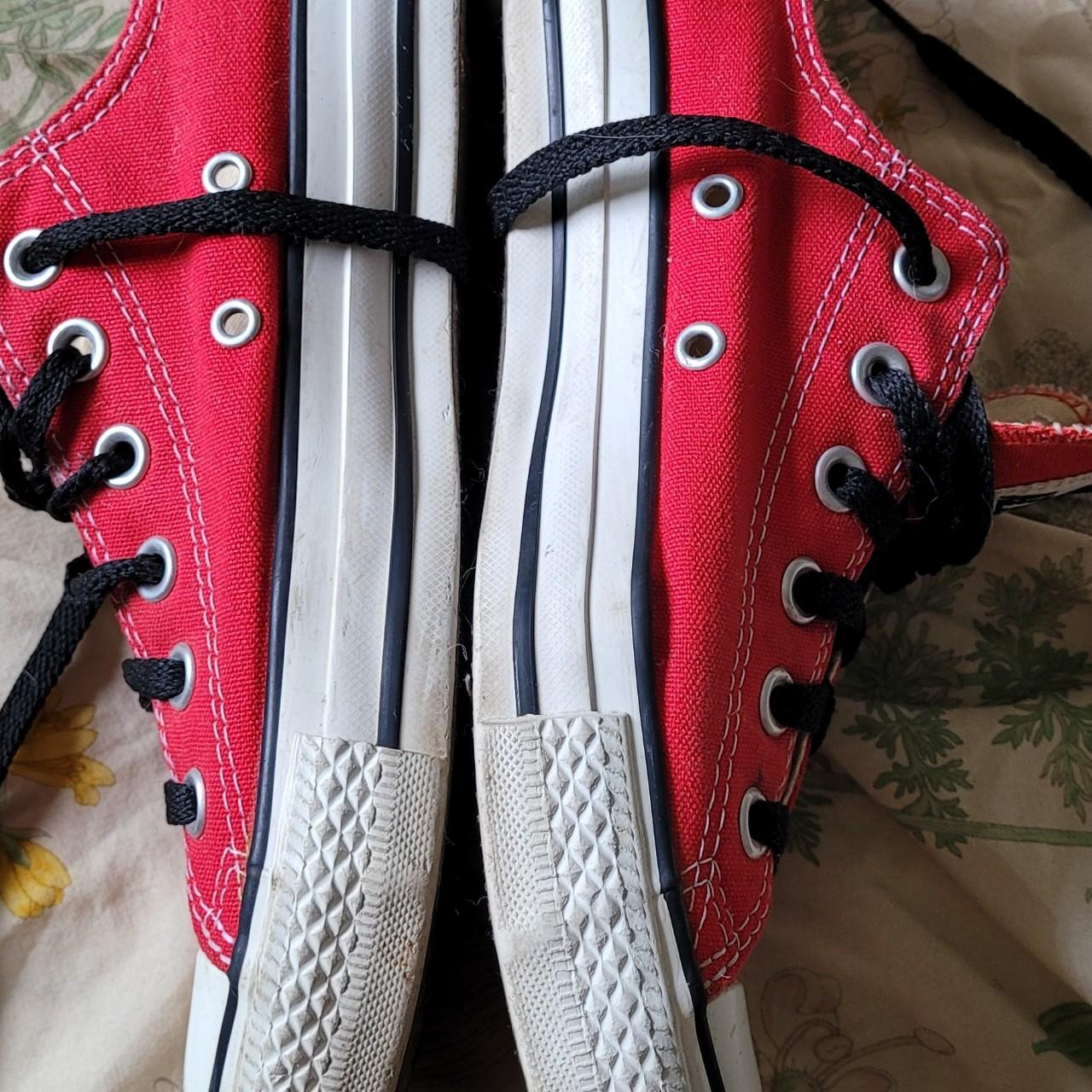 Low top red converse with black laces Men s