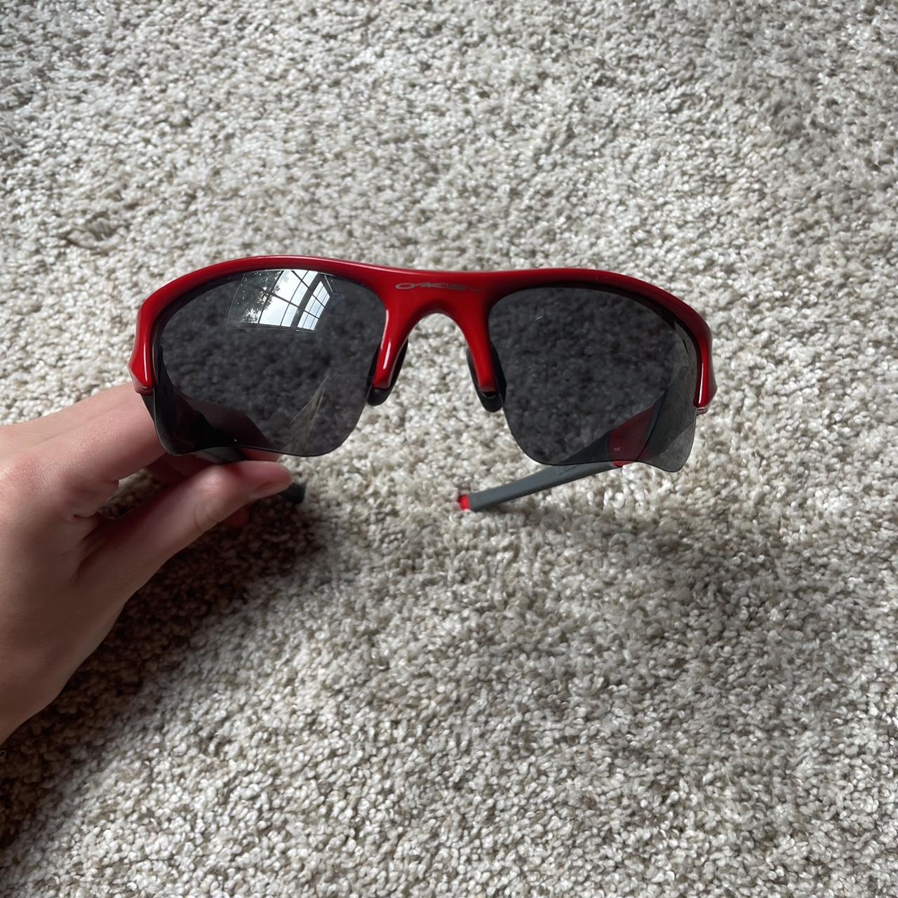 These Red Oakley sunglasses are perfect for a sunny - Depop