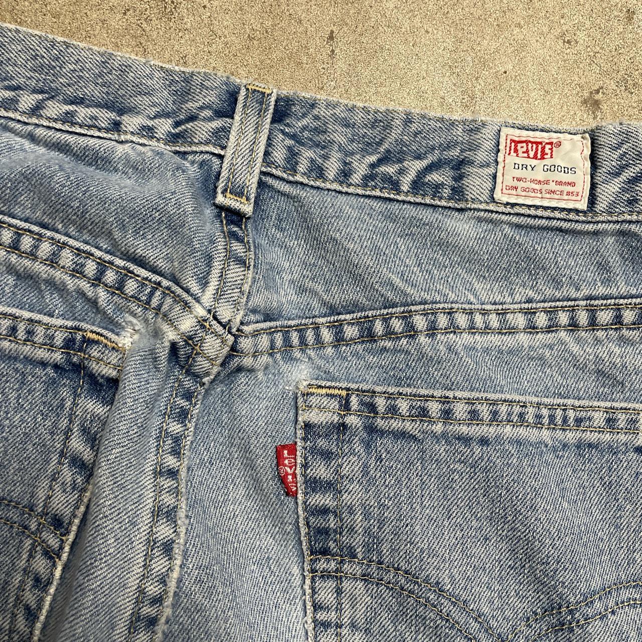 Levi's Women's Blue and White Jeans | Depop