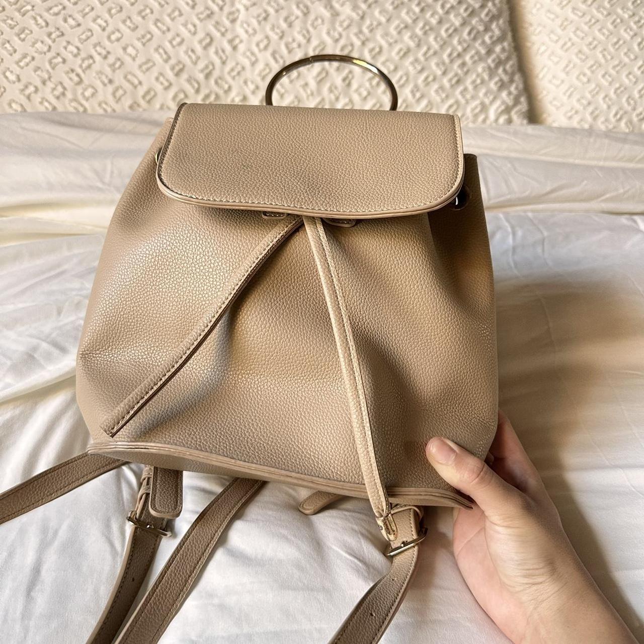Cream and tan leather backpack with gold