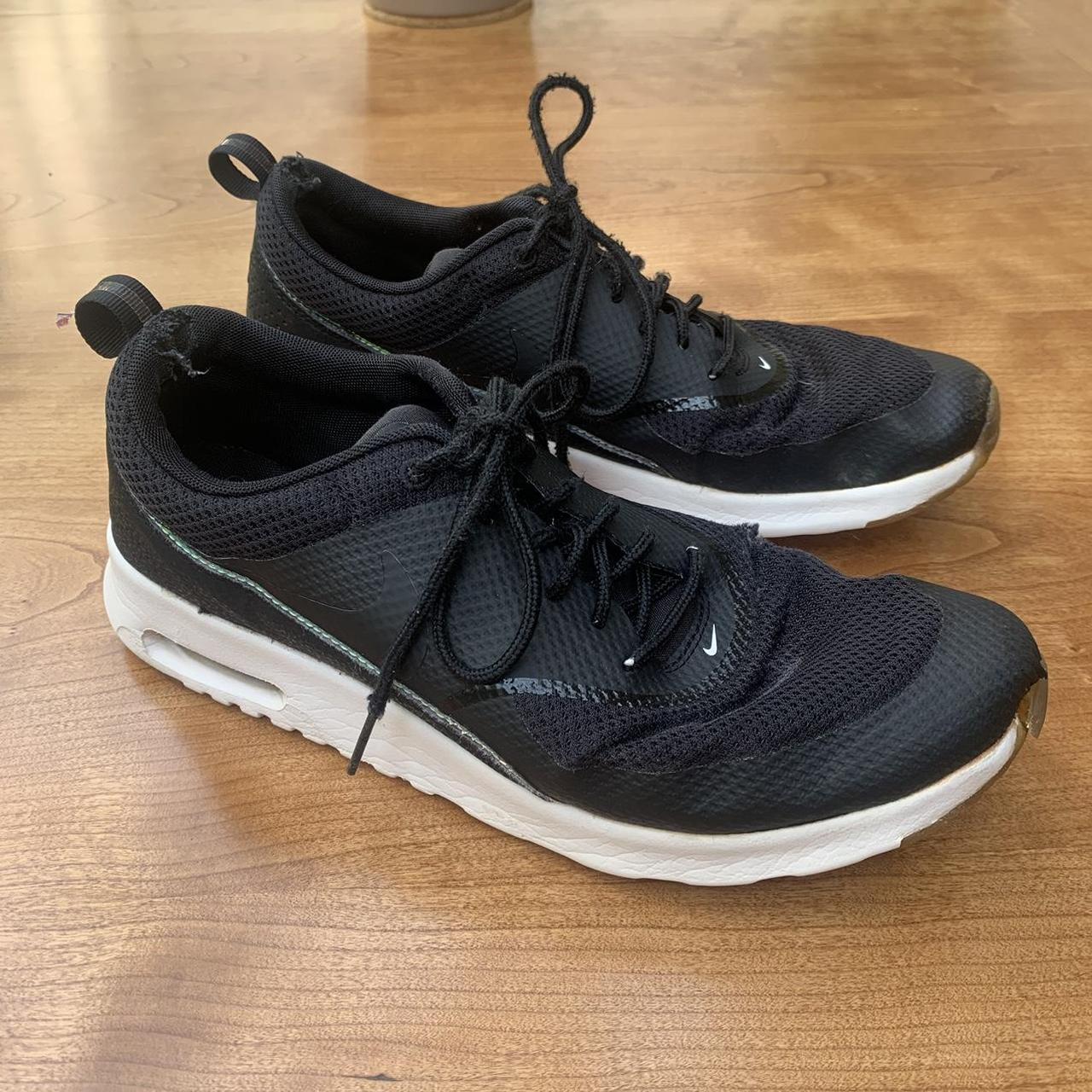 black nike air max thea trainers with white sole and