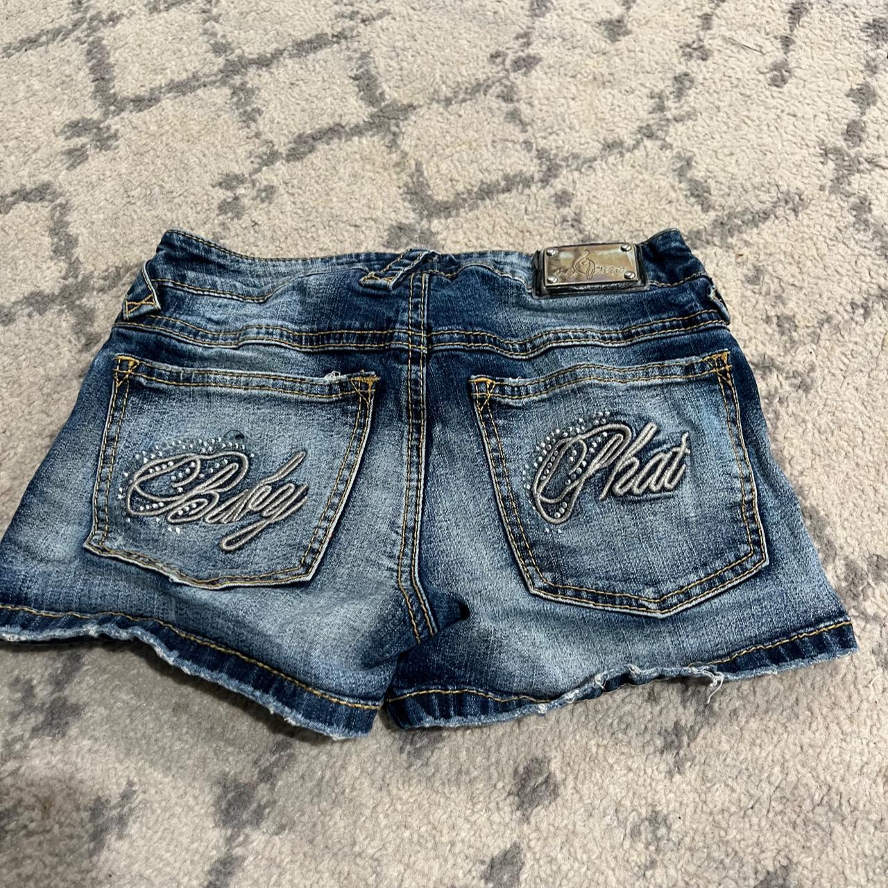 Baby Phat jean shorts graphic on the pockets... - Depop